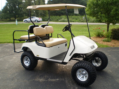 a golf cart parked on a driveway